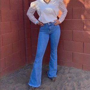 Striped flared Cello Jeans. High rise, frayed hem
